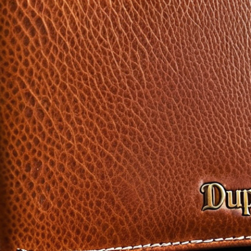 Home 4 **Close-up of a new DuPont leather wallet.** Focus on the texture of the leather, the stitching, and the overall elegant design. Emphasize the feeling of luxury and quality. Use natural lighting.